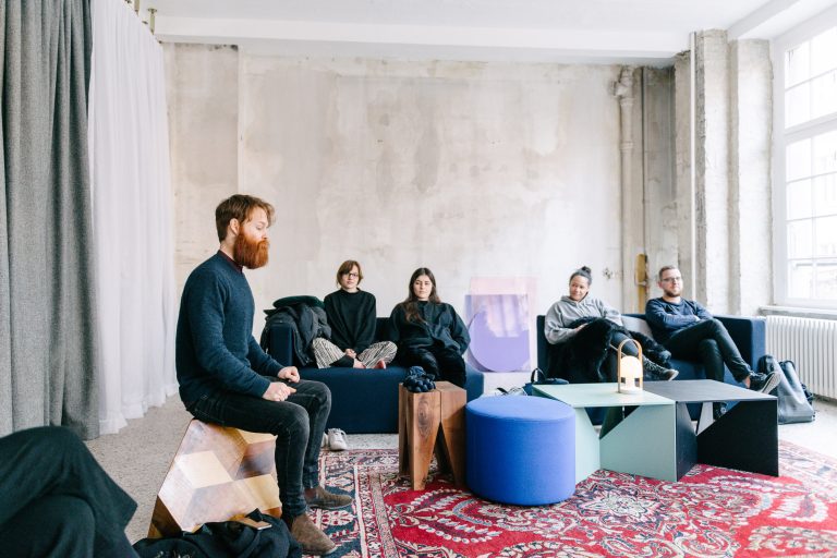 Group of people learning to meditate